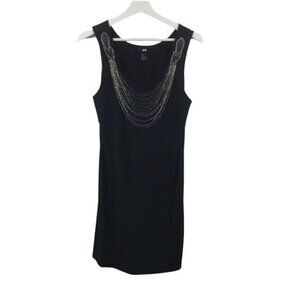 H &‎ M sleeveless black mini dress with beaded “necklace” accent. Size M